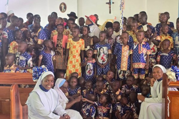 Children with sisters inside the church
